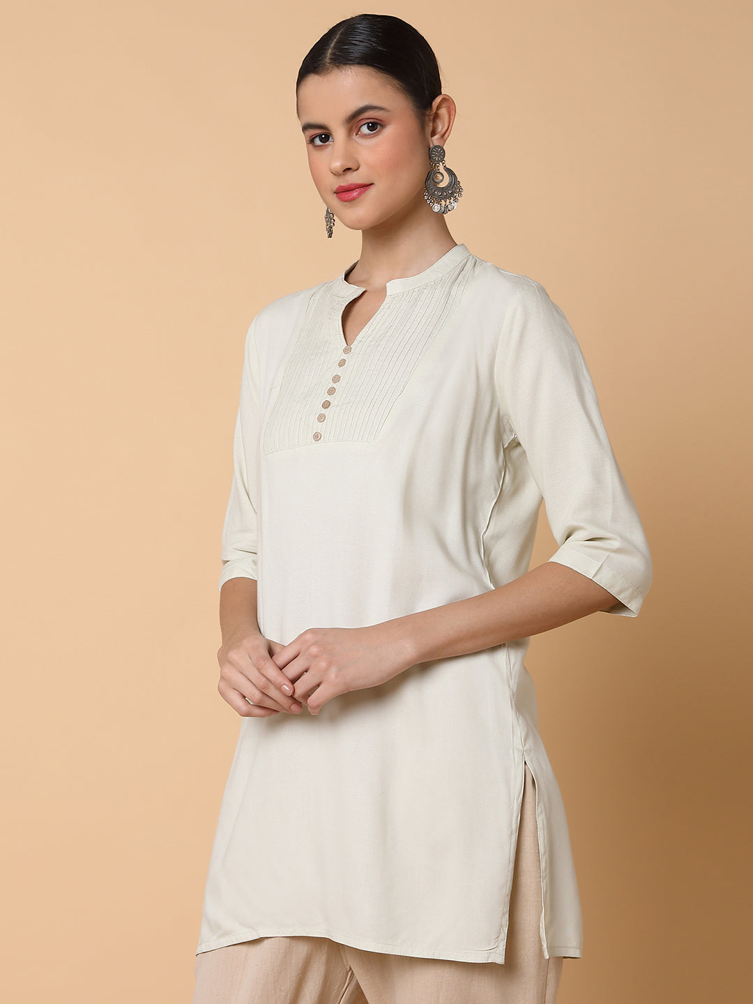 Women Solid Beige Straight Kurti