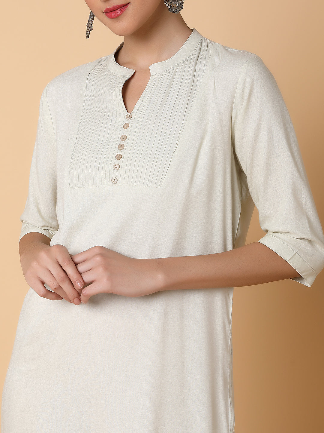 Women Solid Beige Straight Kurti