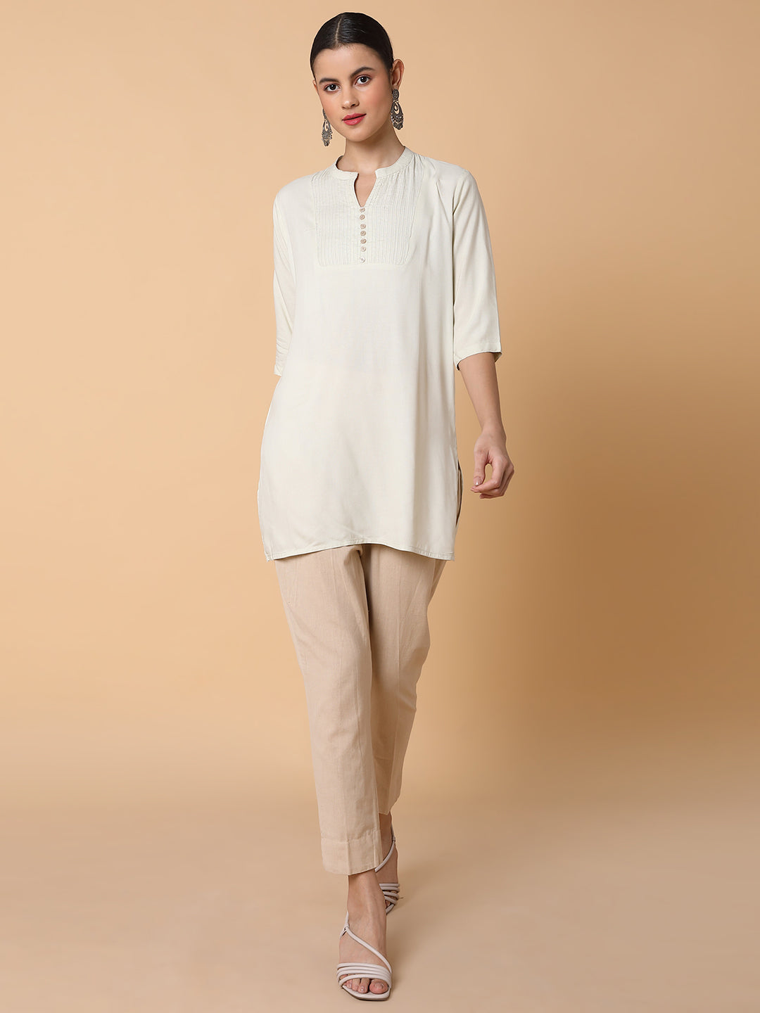 Women Solid Beige Straight Kurti