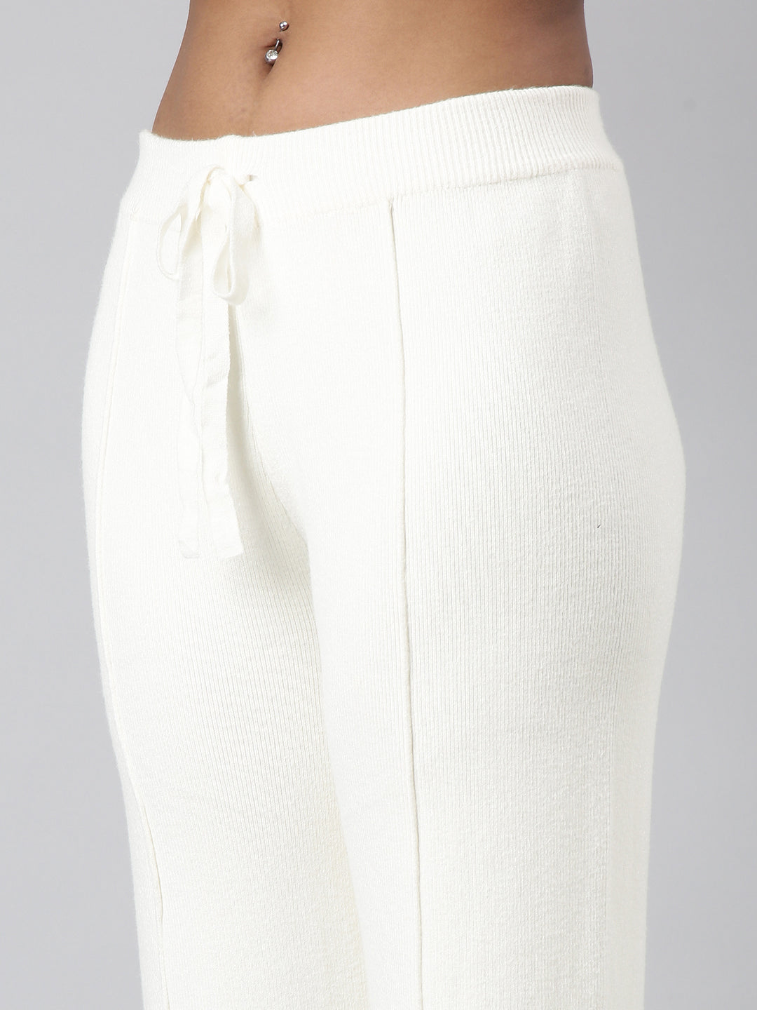 Women Solid Cream Parallel Trousers